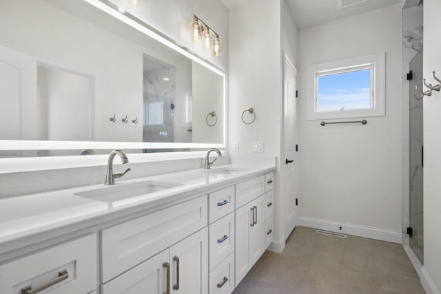 bathroom featuring vanity and an enclosed shower