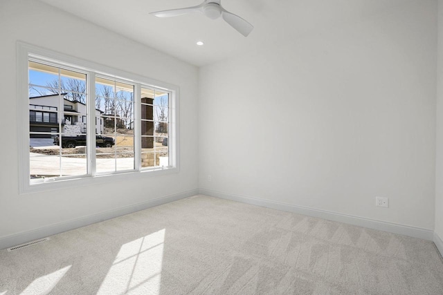 carpeted empty room with ceiling fan