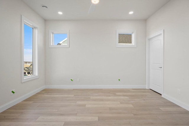 unfurnished room featuring light hardwood / wood-style floors and ceiling fan