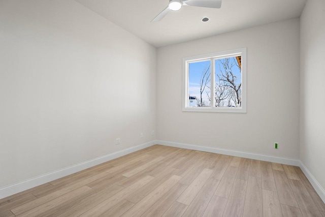 unfurnished room featuring ceiling fan and light wood-type flooring