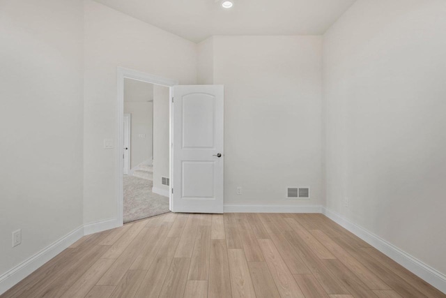 unfurnished room featuring light hardwood / wood-style floors