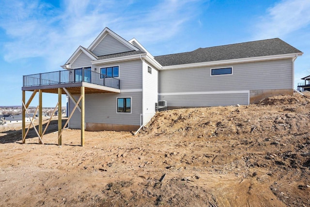 rear view of property with a wooden deck