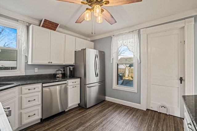 kitchen featuring white cabinetry, ornamental molding, dark hardwood / wood-style floors, ceiling fan, and stainless steel appliances