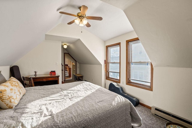 carpeted bedroom with vaulted ceiling, ceiling fan, and baseboard heating