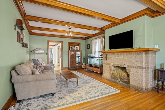 living room with beamed ceiling, wood-type flooring, and a fireplace