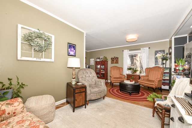 living room with ornamental molding and light wood-type flooring