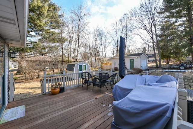 wooden terrace featuring a storage unit