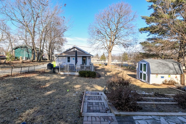 exterior space featuring a storage shed and a deck