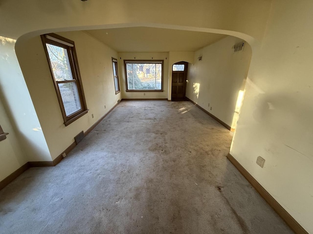 unfurnished room with light colored carpet