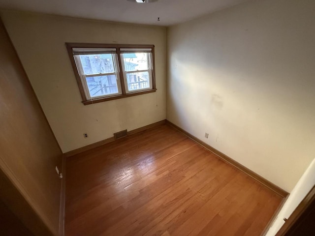 empty room featuring wood-type flooring