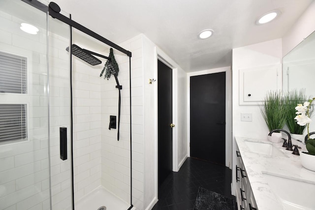 bathroom with tile patterned floors, vanity, and a shower with shower door