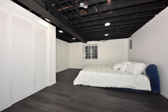 bedroom featuring dark hardwood / wood-style flooring