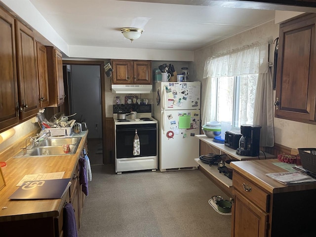 kitchen featuring sink, wooden counters, electric range oven, white refrigerator, and black electric stovetop