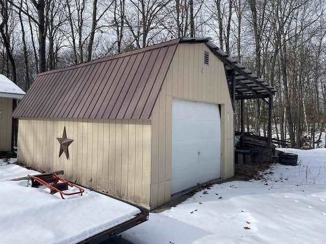 view of snow covered garage