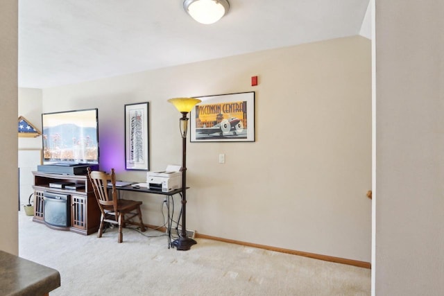 office featuring baseboards and carpet flooring