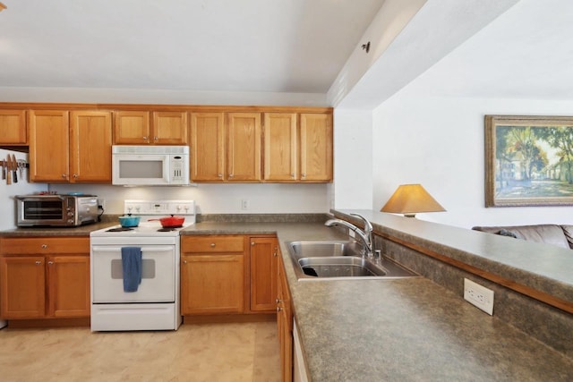 kitchen featuring white appliances, a toaster, brown cabinets, and a sink