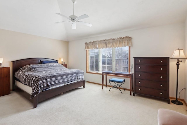 bedroom featuring baseboards, lofted ceiling, light colored carpet, and a ceiling fan