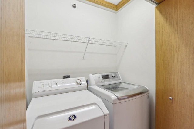 washroom with laundry area and separate washer and dryer