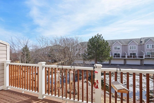 wooden deck featuring a residential view