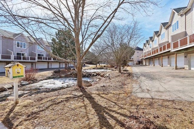 view of street with community garages and a residential view