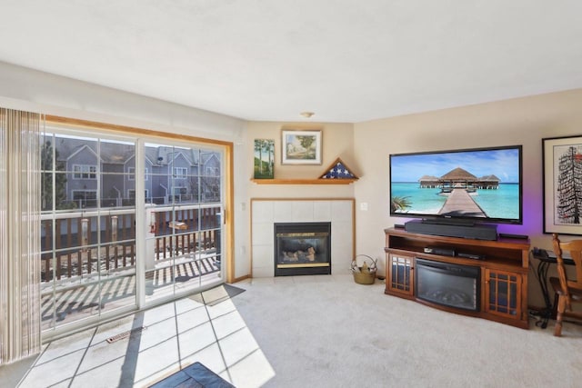 carpeted living area with a fireplace