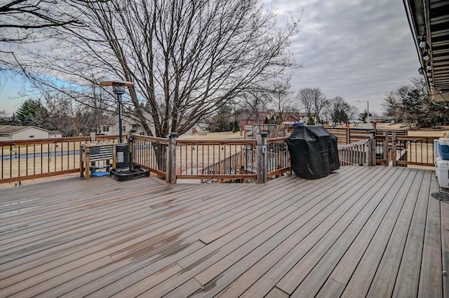 wooden deck with area for grilling