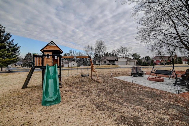 view of playground featuring an outdoor fire pit