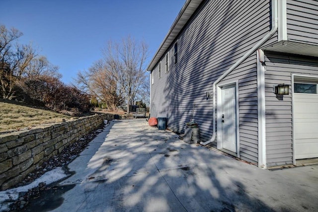 view of side of property featuring a garage