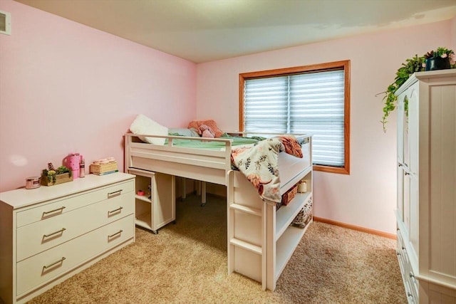 bedroom featuring light colored carpet