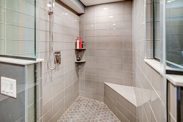 bathroom featuring a tile shower