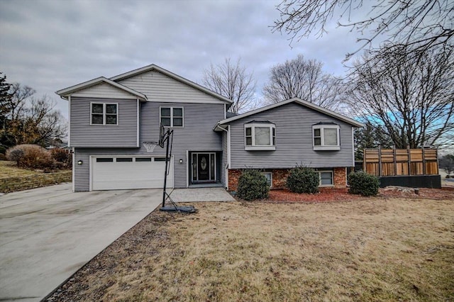 view of front of property with a garage and a front lawn