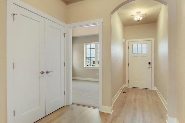 foyer entrance with light hardwood / wood-style flooring