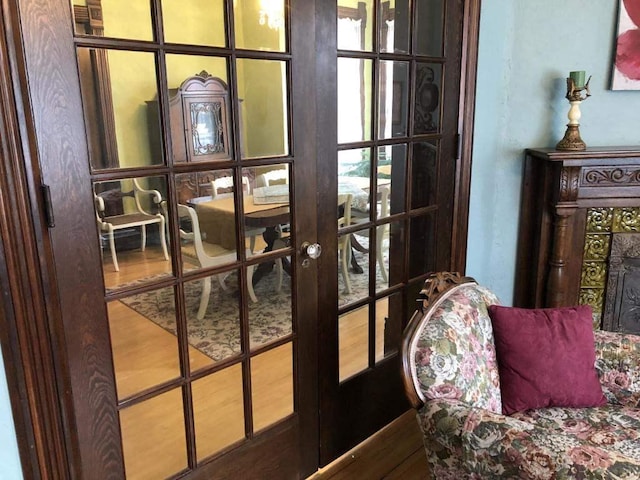 doorway featuring wood-type flooring and french doors