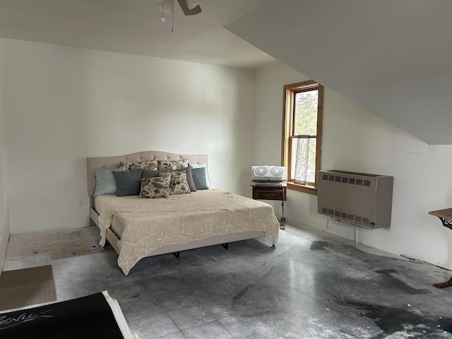 bedroom with heating unit, lofted ceiling, and ceiling fan