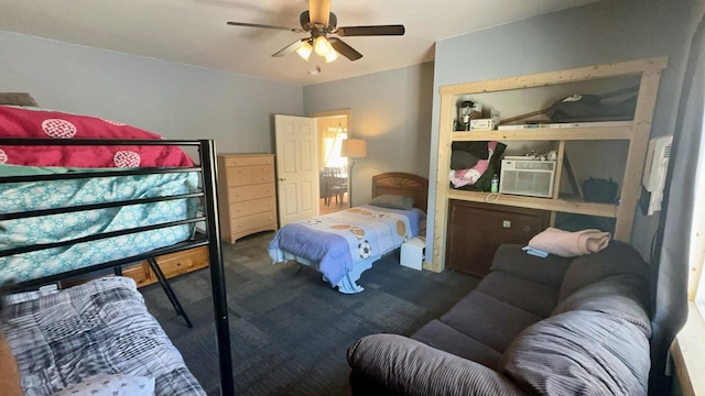 bedroom with ceiling fan and dark carpet