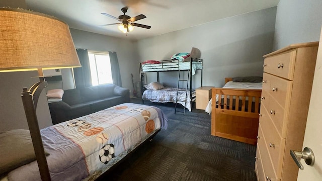 bedroom with dark carpet and ceiling fan