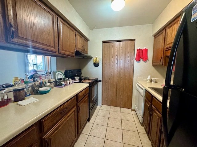 kitchen with light tile patterned floors and black appliances