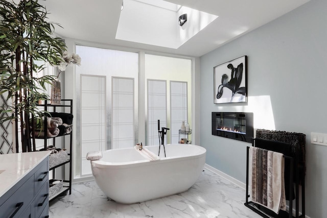 bathroom with vanity and a bath