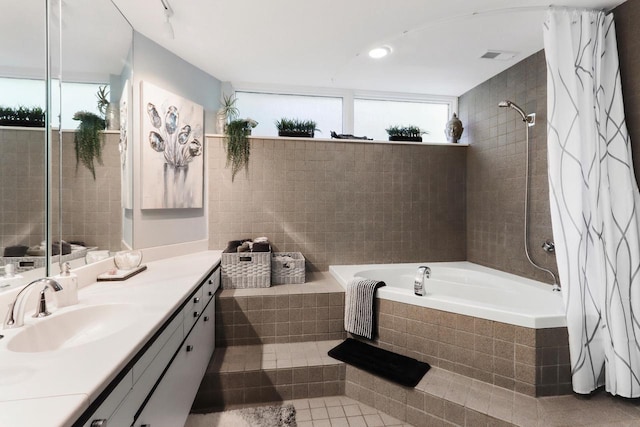 bathroom with vanity, plenty of natural light, and plus walk in shower