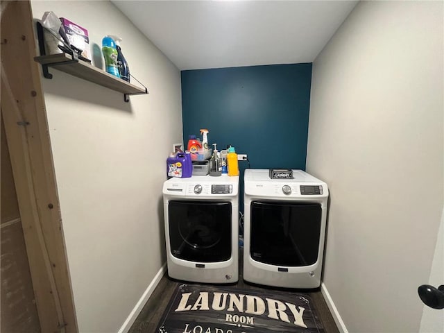 laundry area featuring dark hardwood / wood-style flooring and washer and dryer