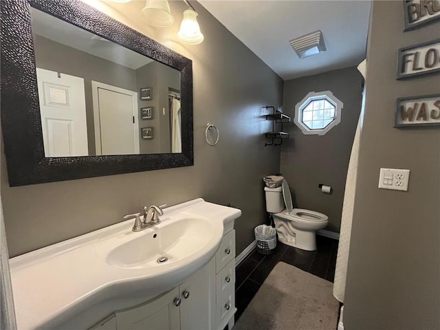 bathroom with vanity and toilet