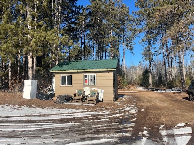 exterior space with an outbuilding