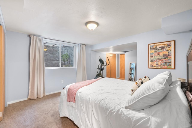 bedroom featuring carpet floors and a textured ceiling