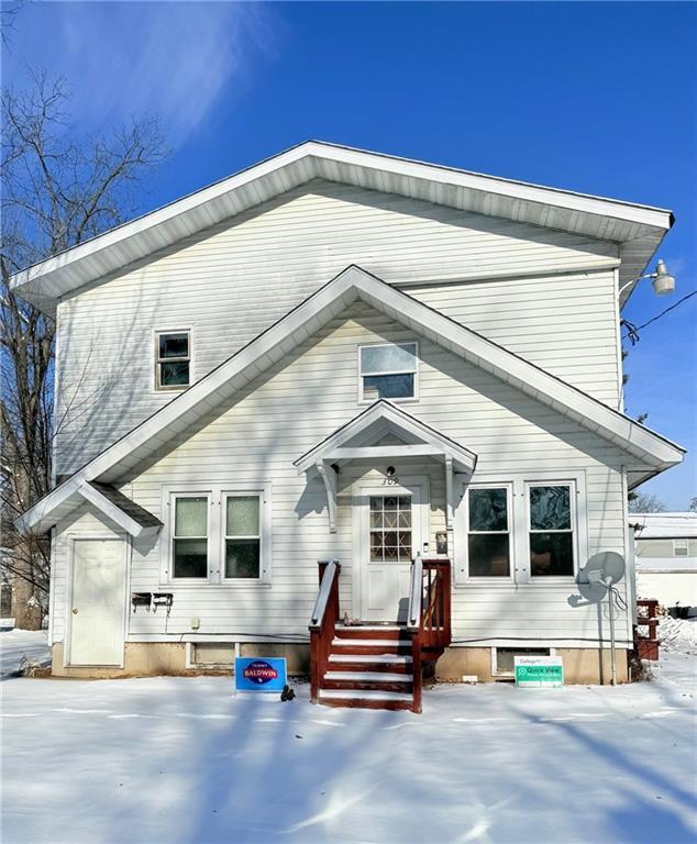 view of snow covered house