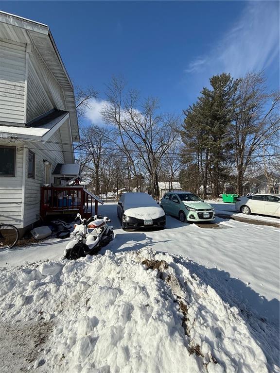 view of snow covered parking area