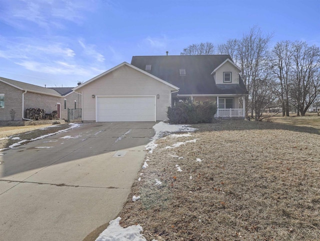 view of front of property with a garage and covered porch