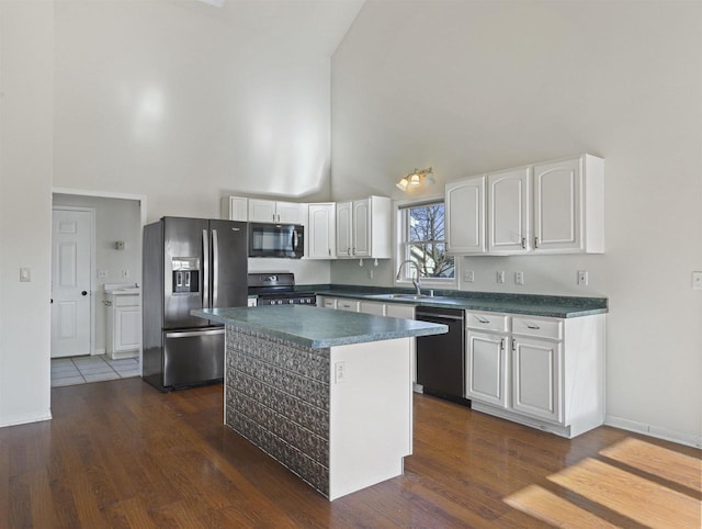 kitchen featuring high vaulted ceiling, black appliances, white cabinets, a kitchen island, and dark hardwood / wood-style flooring