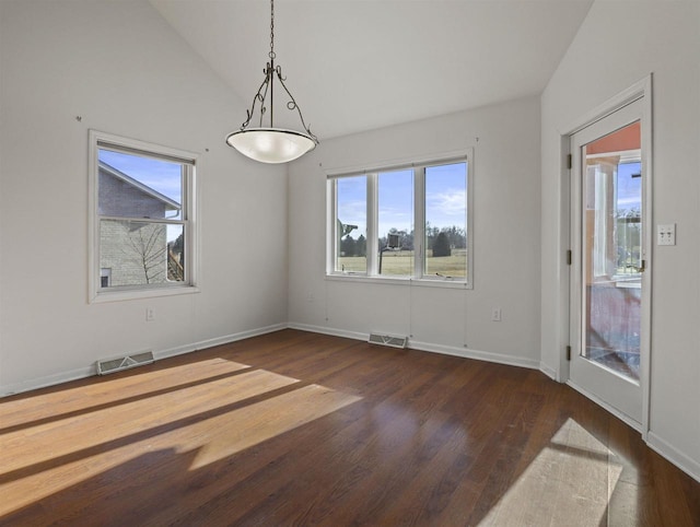 unfurnished dining area featuring dark hardwood / wood-style flooring and vaulted ceiling