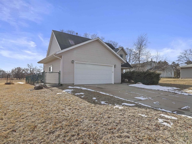 view of side of home with a garage