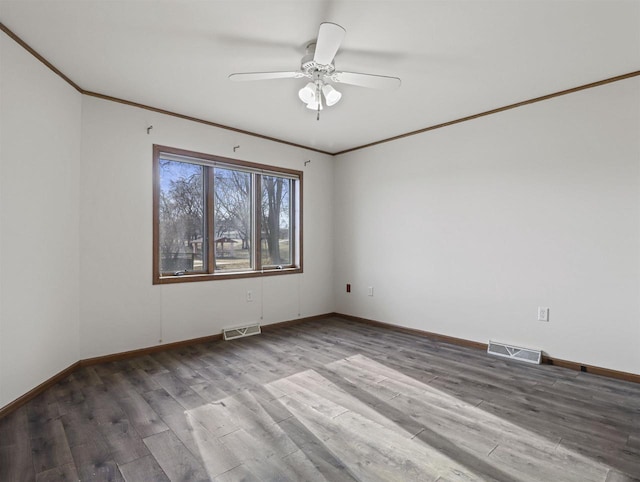 spare room featuring crown molding, hardwood / wood-style flooring, and ceiling fan